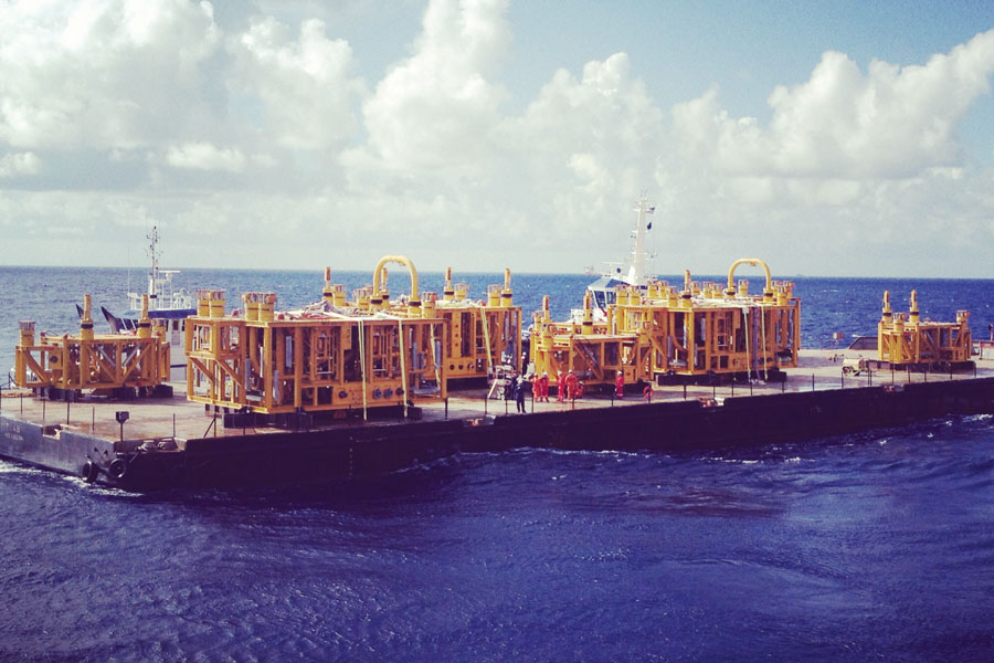 Barge carrying subsea construction equipment
